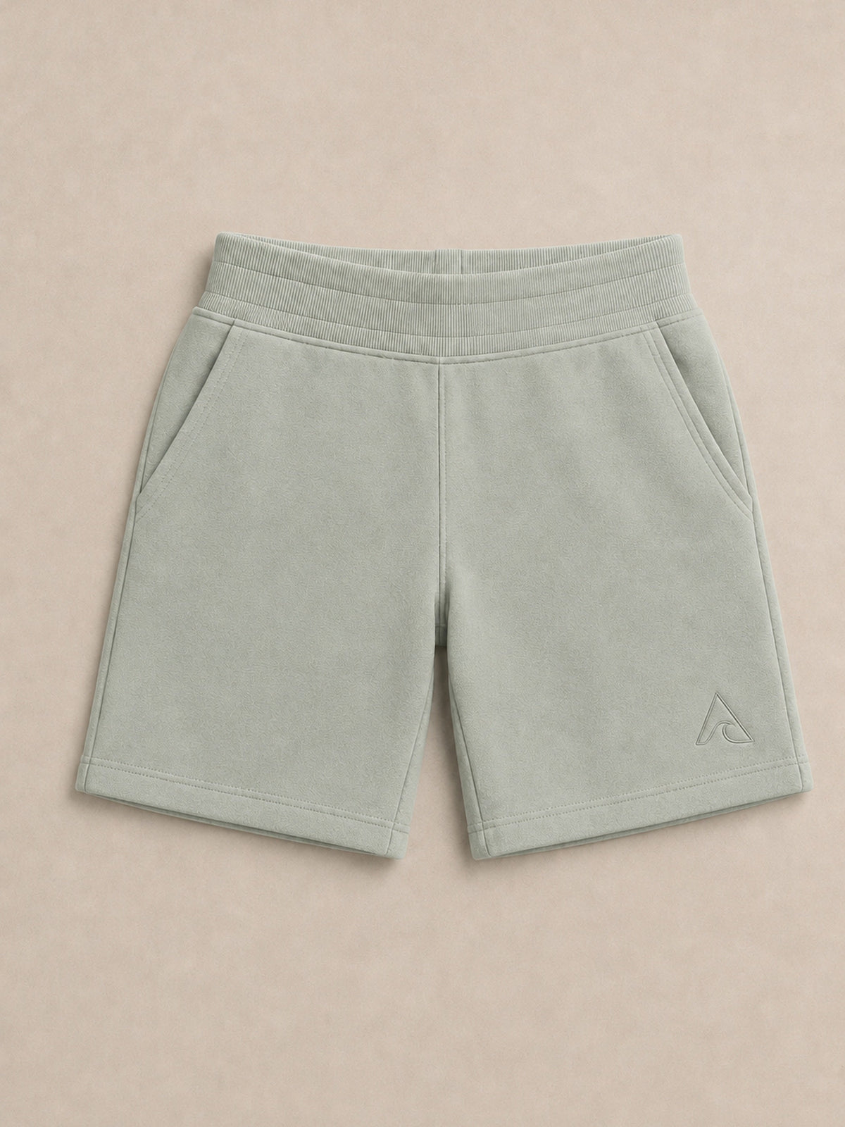 Akumi Little Driftlight Short in Cloud Sage flat lay with corrected A-wave logo