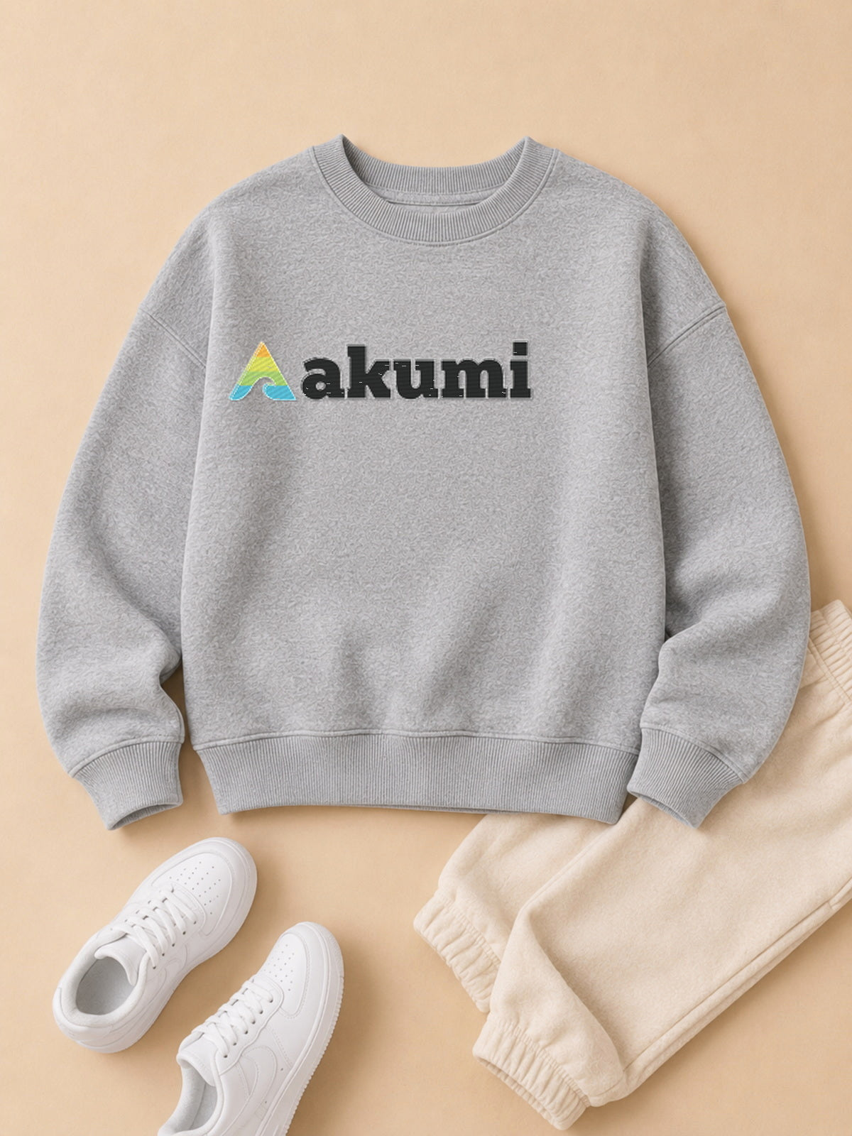 Akumi Little Varsitymark Crew Campus Grey flat lay with realistic embroidered Akumi logo
