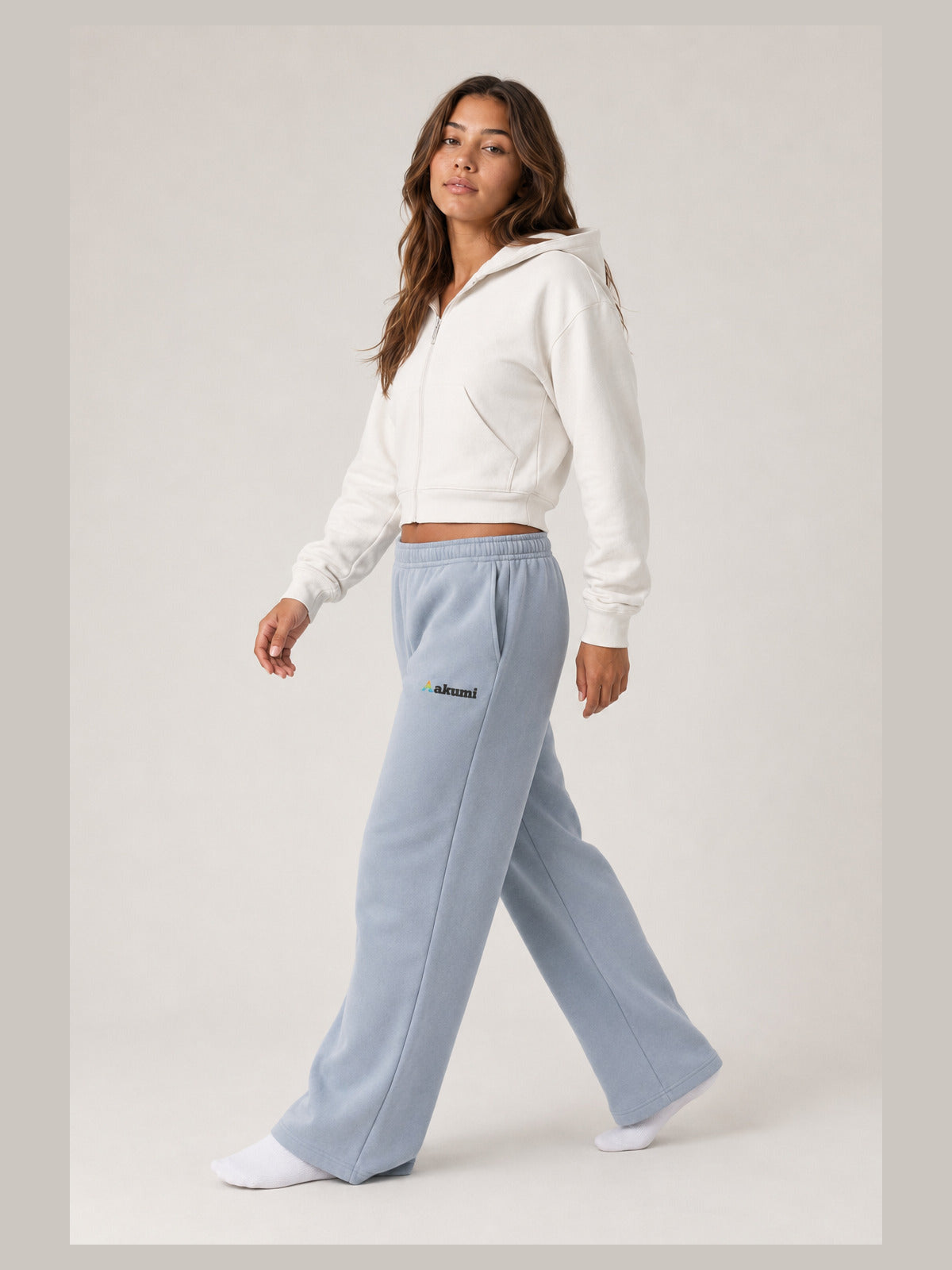 Akumi Openform Straight-Leg Sweatpant in Rainwash Blue, side walking studio view
