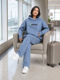 Dust Blue##Akumi Passage Hoodie, seated travel lifestyle