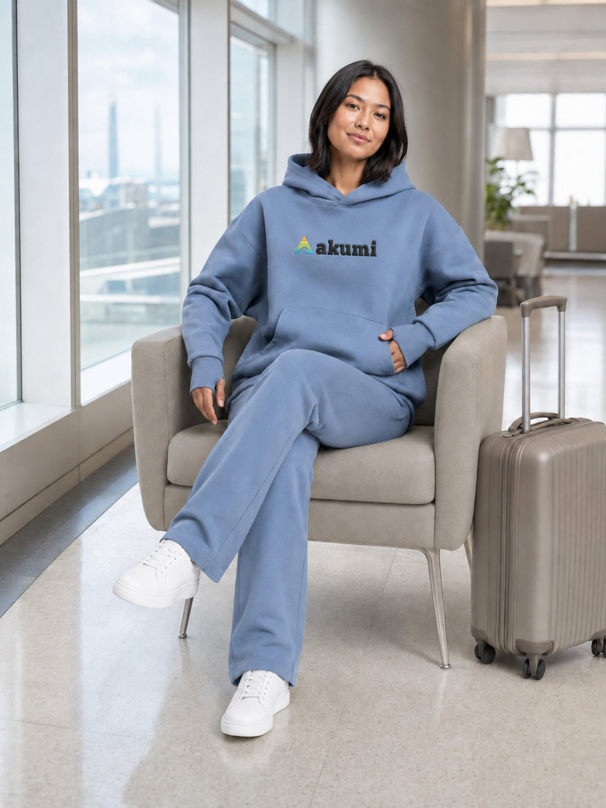 Dust Blue##Akumi Passage Hoodie, seated travel lifestyle