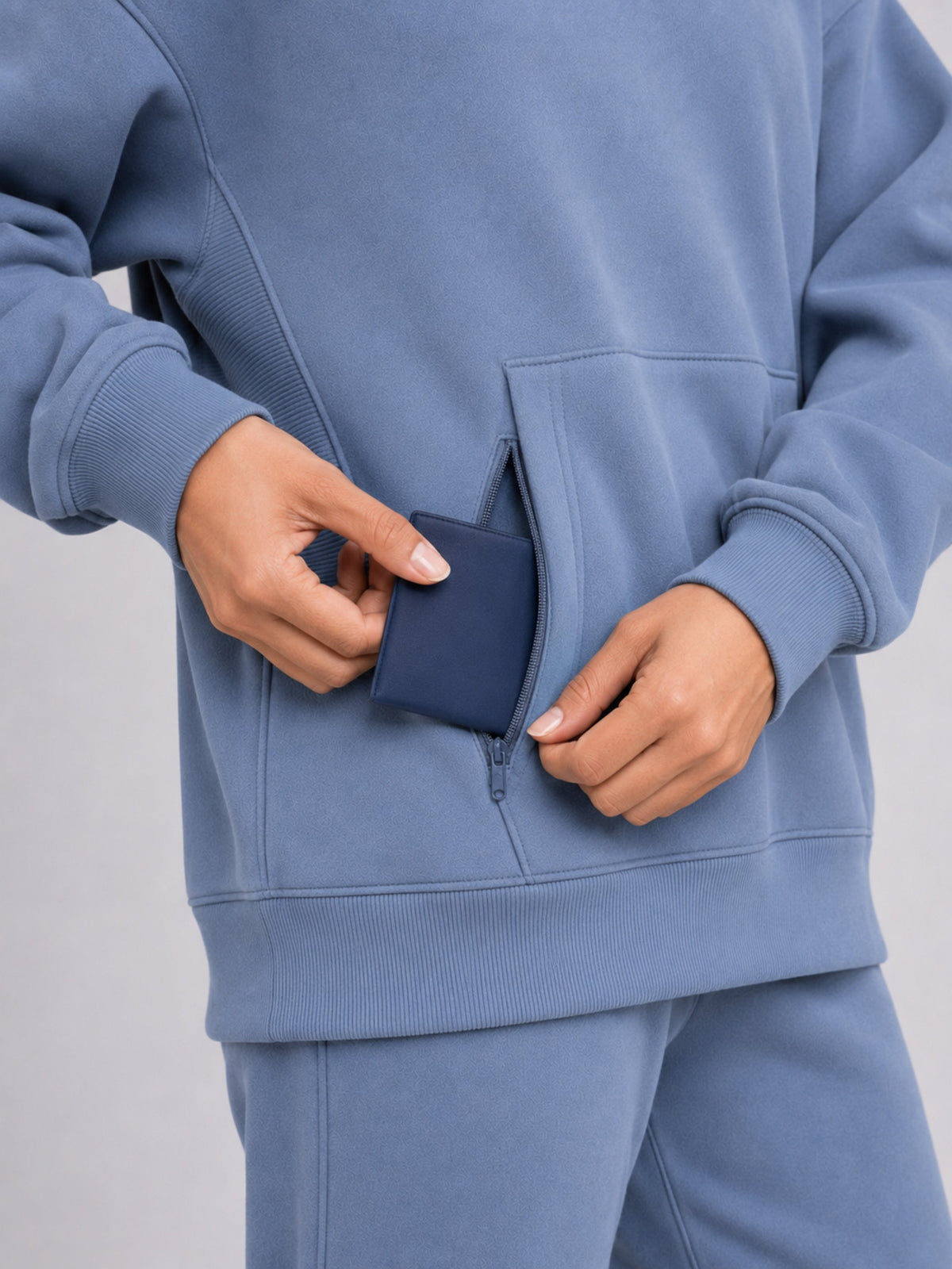 Dust Blue##Akumi Passage Hoodie, concealed side-entry passport pocket detail
