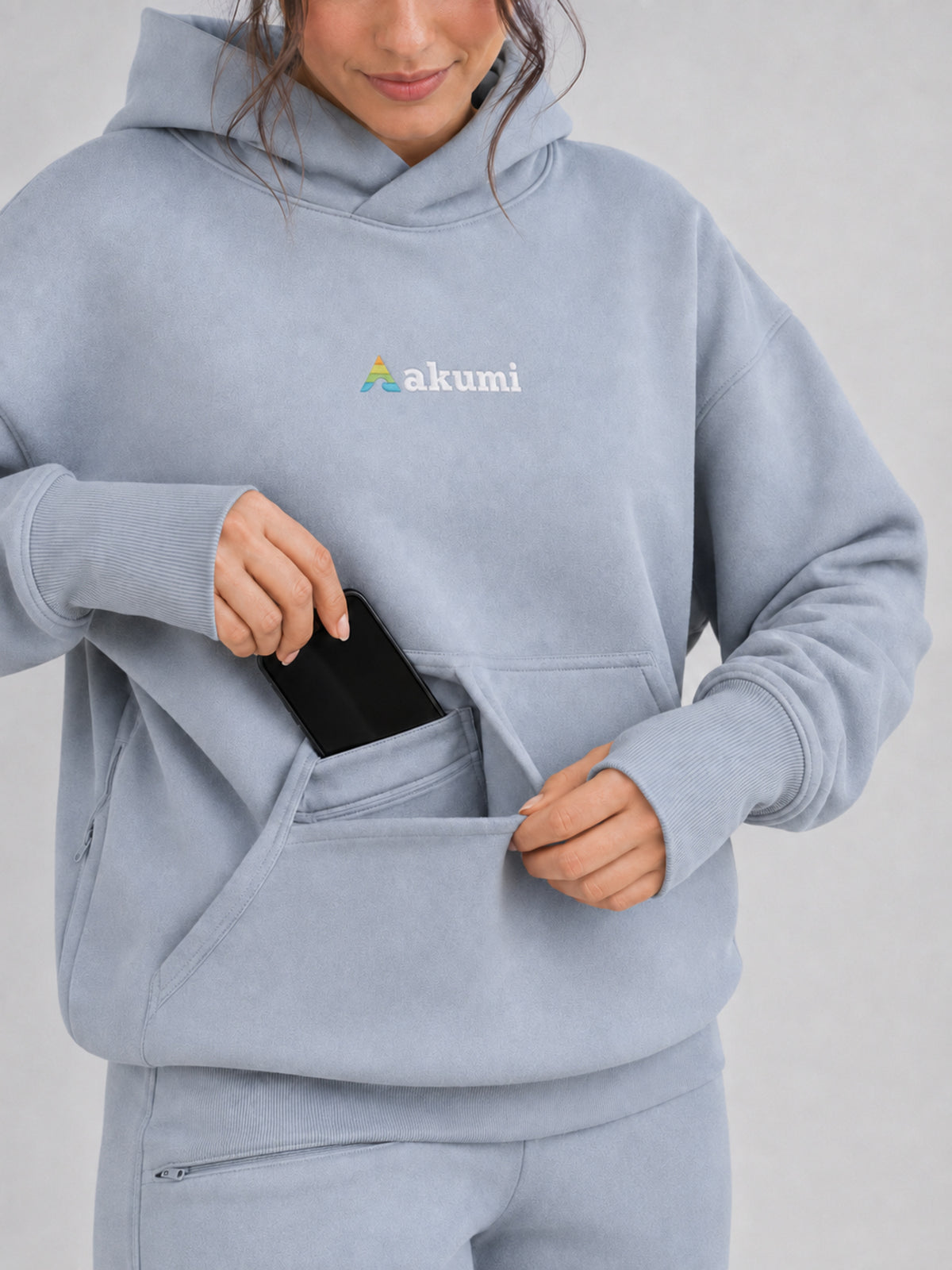 Akumi Quiet Transit Hoodie kangaroo organizer and thumbhole cuff detail