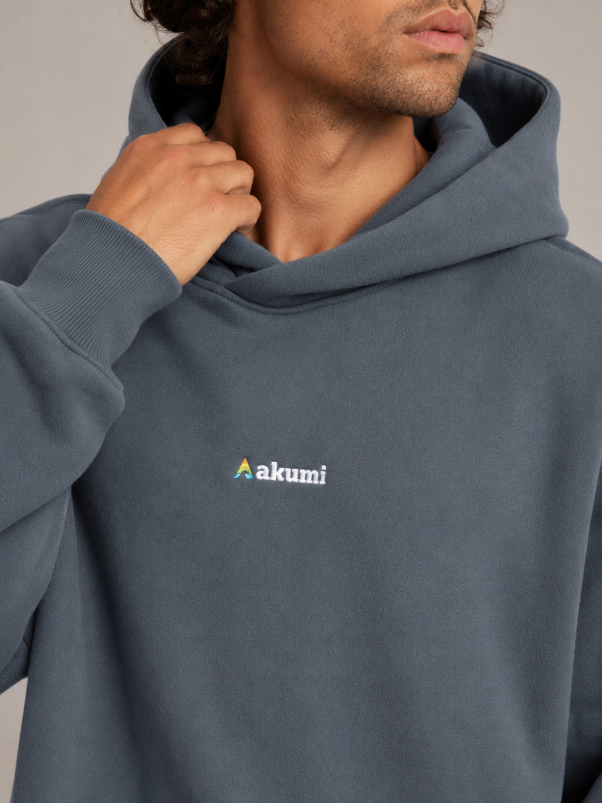 Akumi Reserve Pocket Hoodie in Harbor Ash hood and chest logo detail