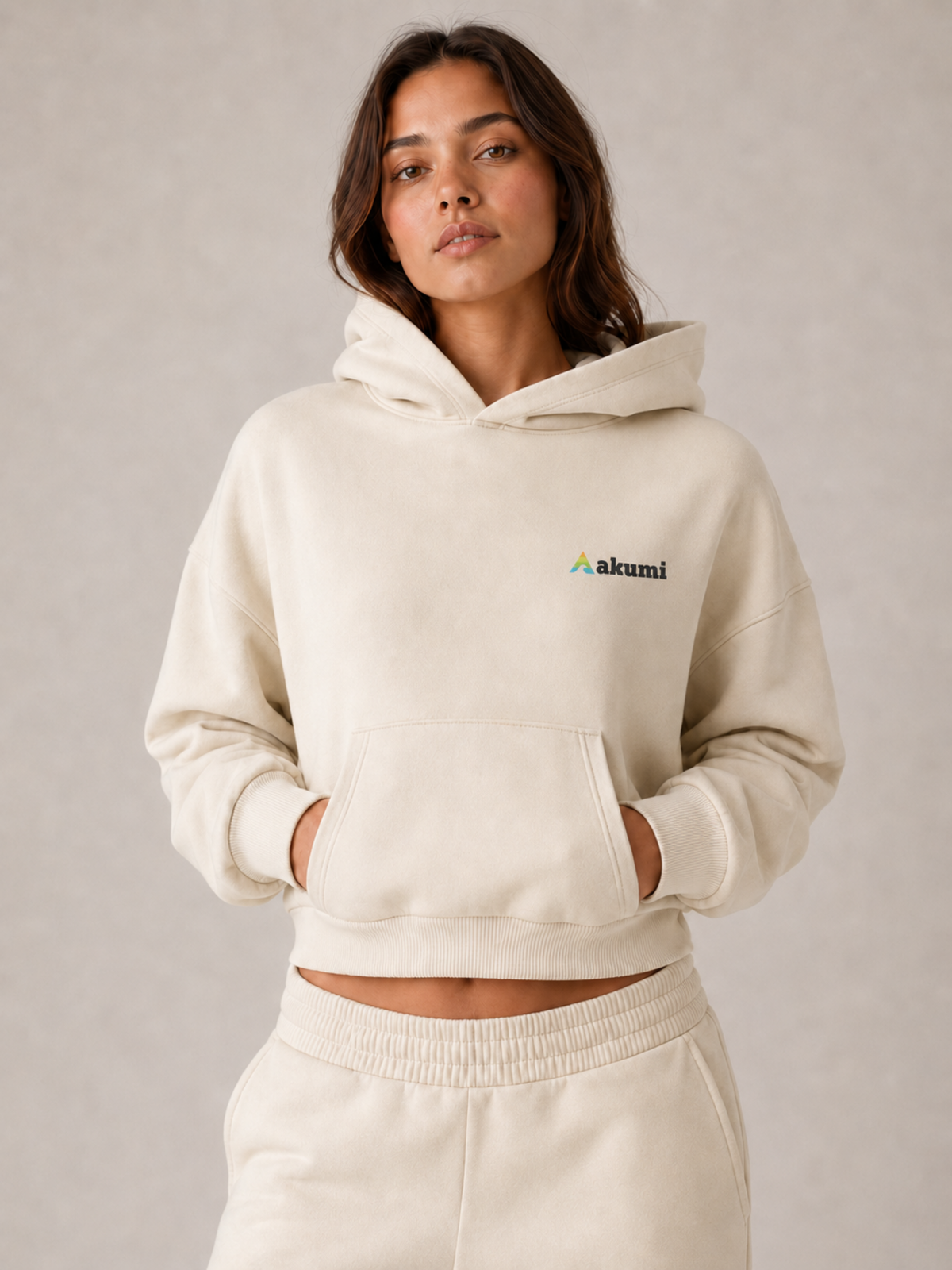 Akumi Softbreak Crop Hoodie in Salt Cream, close product view with exact Akumi embroidery