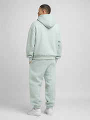 Akumi Softglow Hoodie in Glacier Mint male back studio view