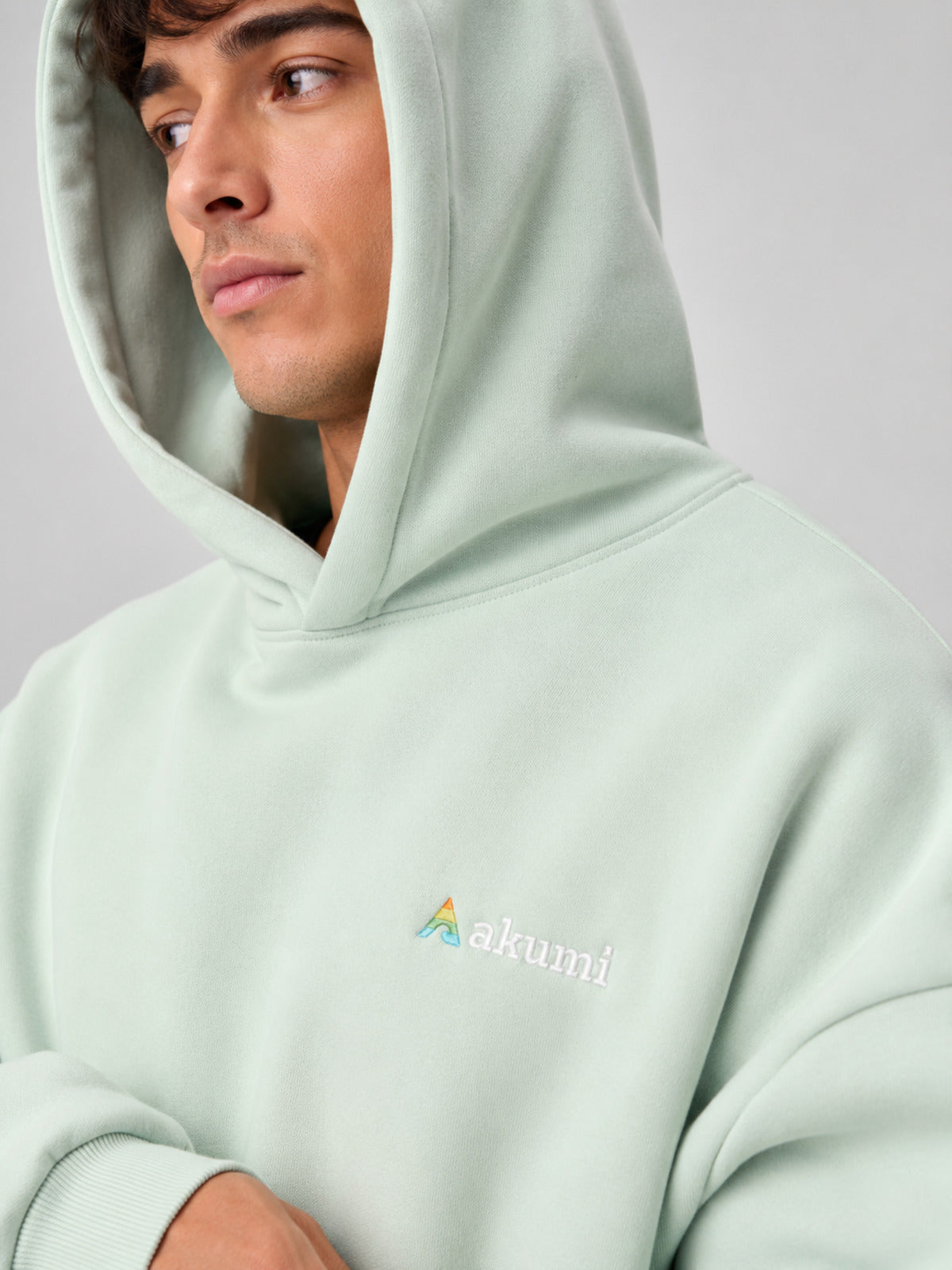 Akumi Softglow Hoodie in Glacier Mint hood and embroidery detail