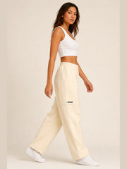 Akumi Softvale Straight-Leg Sweatpant in Buttercream, female model side walking view