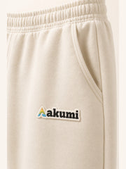 Akumi Softvale Straight-Leg Sweatpant in Buttercream, Akumi logo and pocket detail