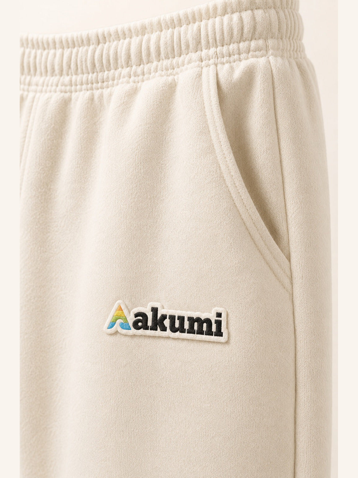 Akumi Softvale Straight-Leg Sweatpant in Buttercream, Akumi logo and pocket detail