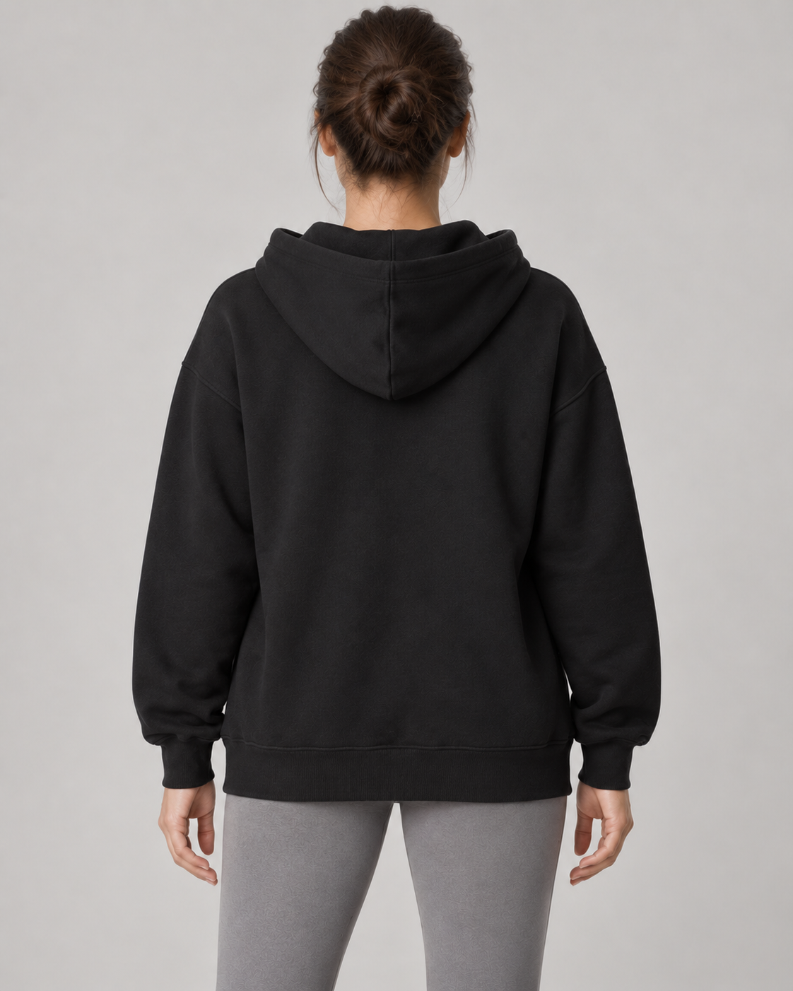 AI-generated design concept: Stillform Full-Zip Hoodie in Onyx, back view.