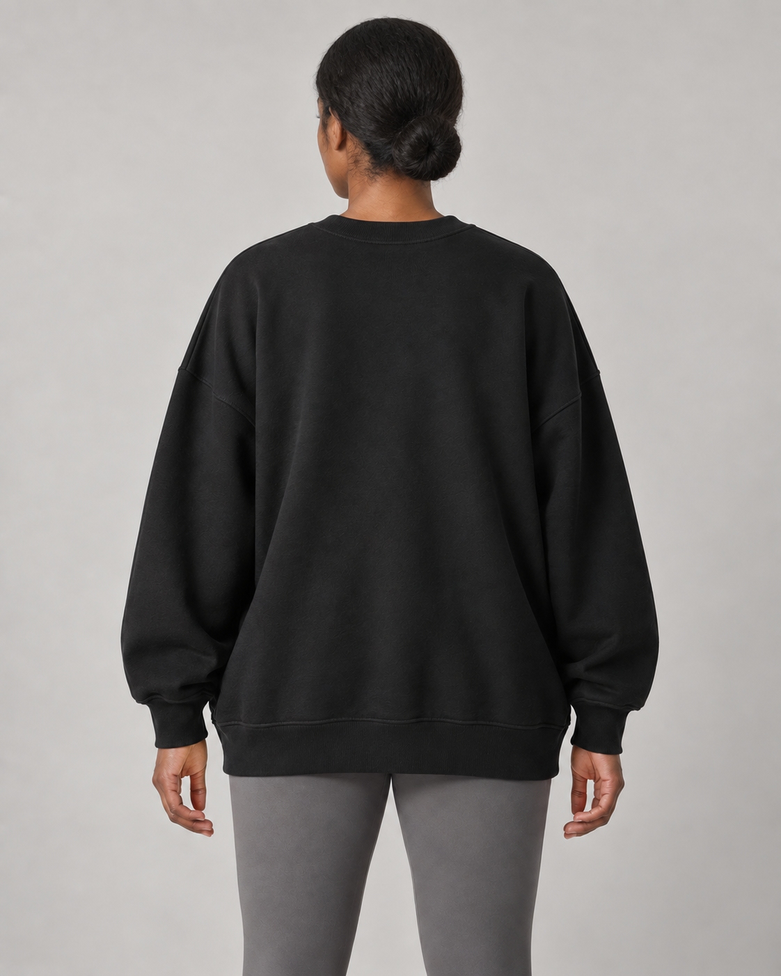 AI-generated design concept: Stillform Oversized Crew in Onyx, back view.