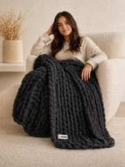Akumi Stonehold Weighted Blanket Carbon Slate hero view with sewn woven hem label