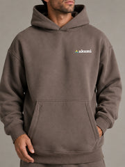 Akumi Stowline Utility Hoodie in Cedar Smoke, logo and utility pocket detail