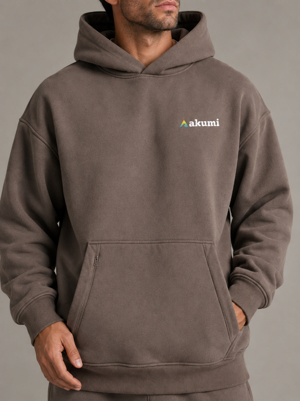 Akumi Stowline Utility Hoodie in Cedar Smoke, logo and utility pocket detail