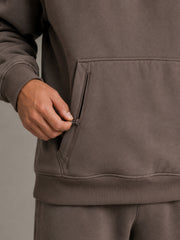 Akumi Stowline Utility Hoodie in Cedar Smoke, concealed pocket system detail