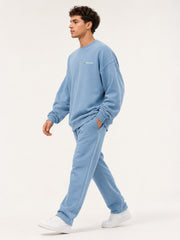 Akumi Studyline Lightweight Crew in Cove Blue, side walking studio view