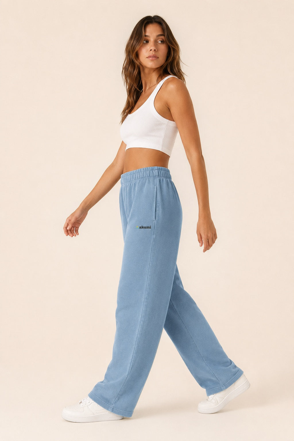 Akumi Tidefade Straight-Leg Sweatpant in Ocean Haze, female model side walking view