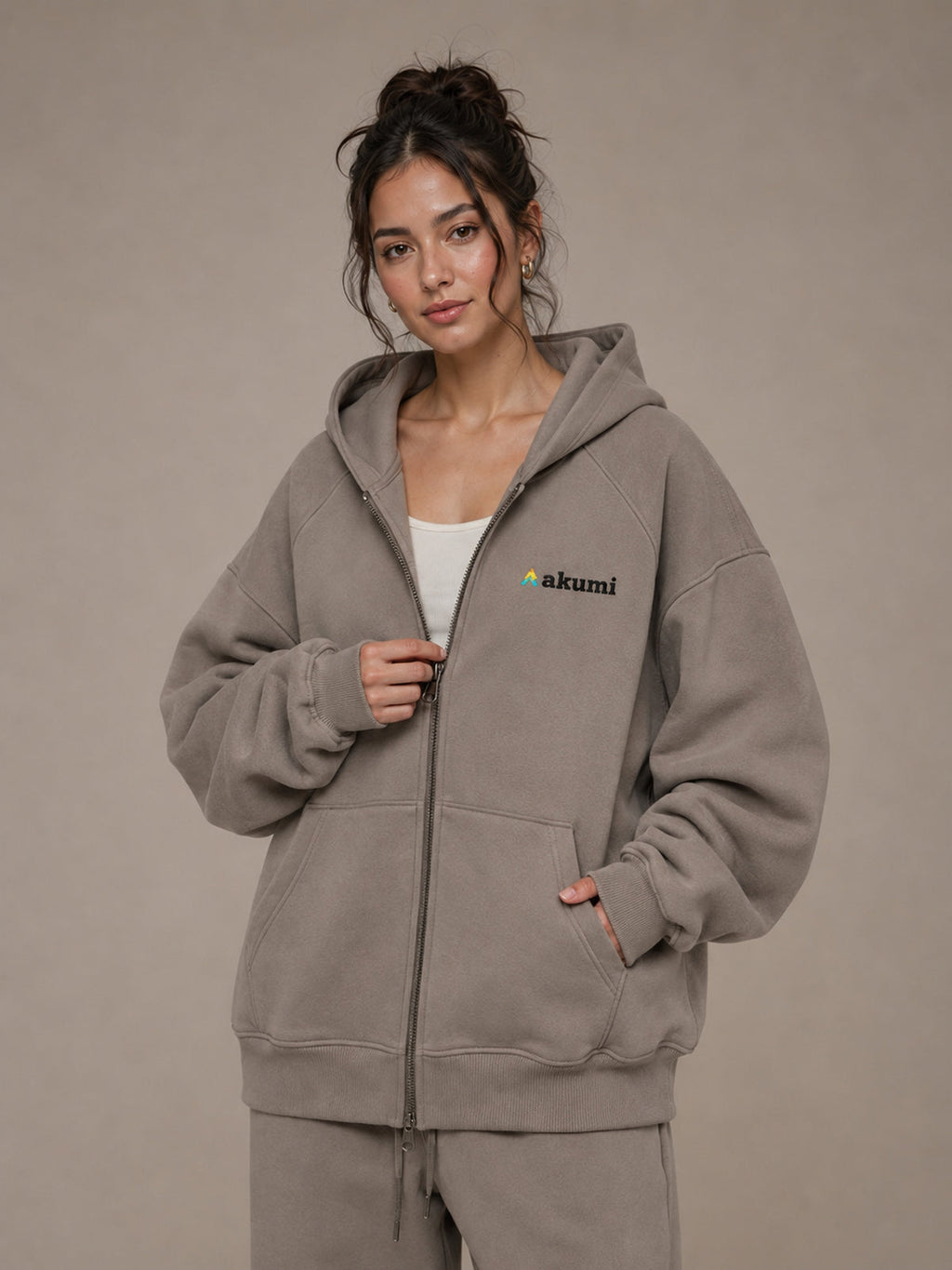 Akumi Veilzip Hoodie in Mineral Taupe, upper body zipper and logo view