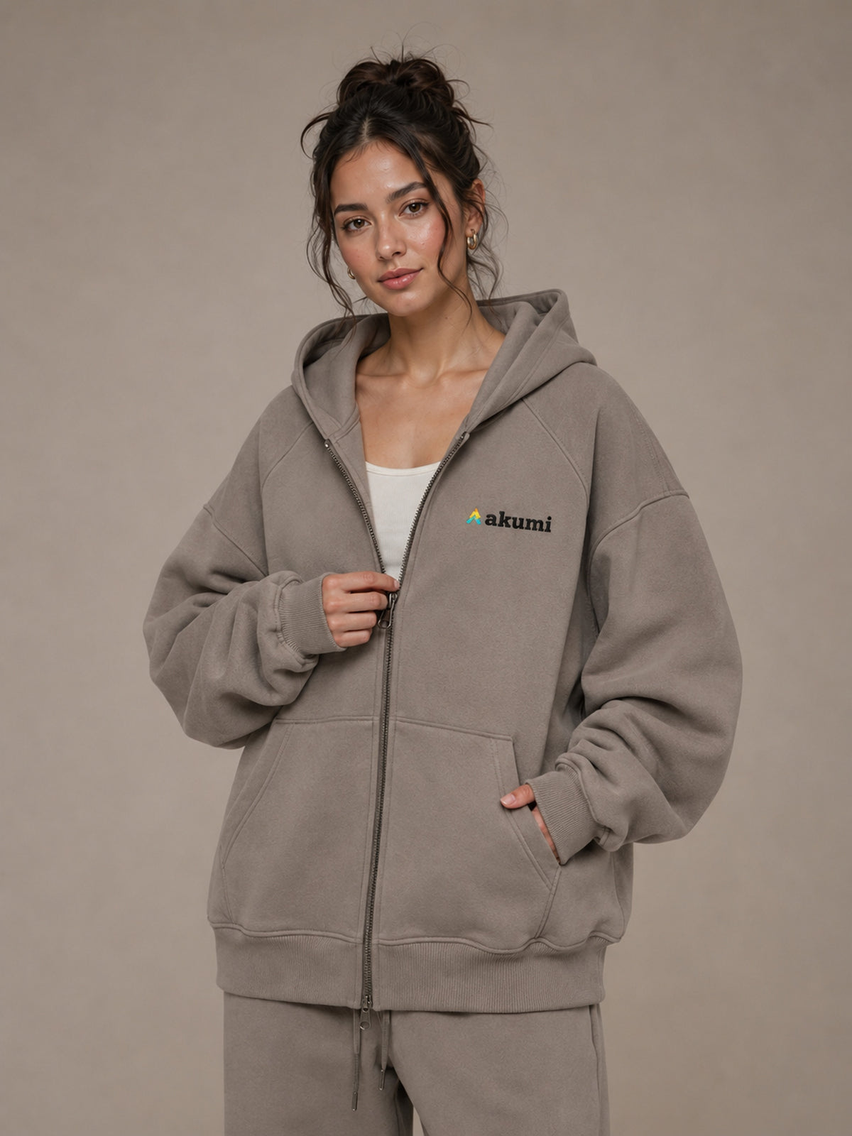 Akumi Veilzip Hoodie in Mineral Taupe, upper body zipper and logo view
