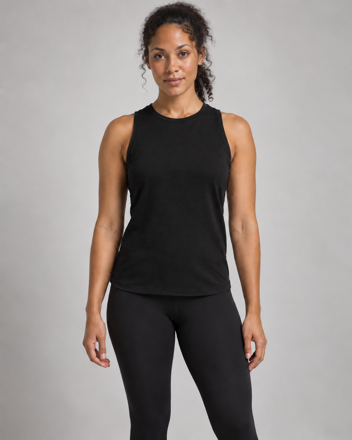 Akumi Motion High-Neck Tank in Black, front studio concept view.