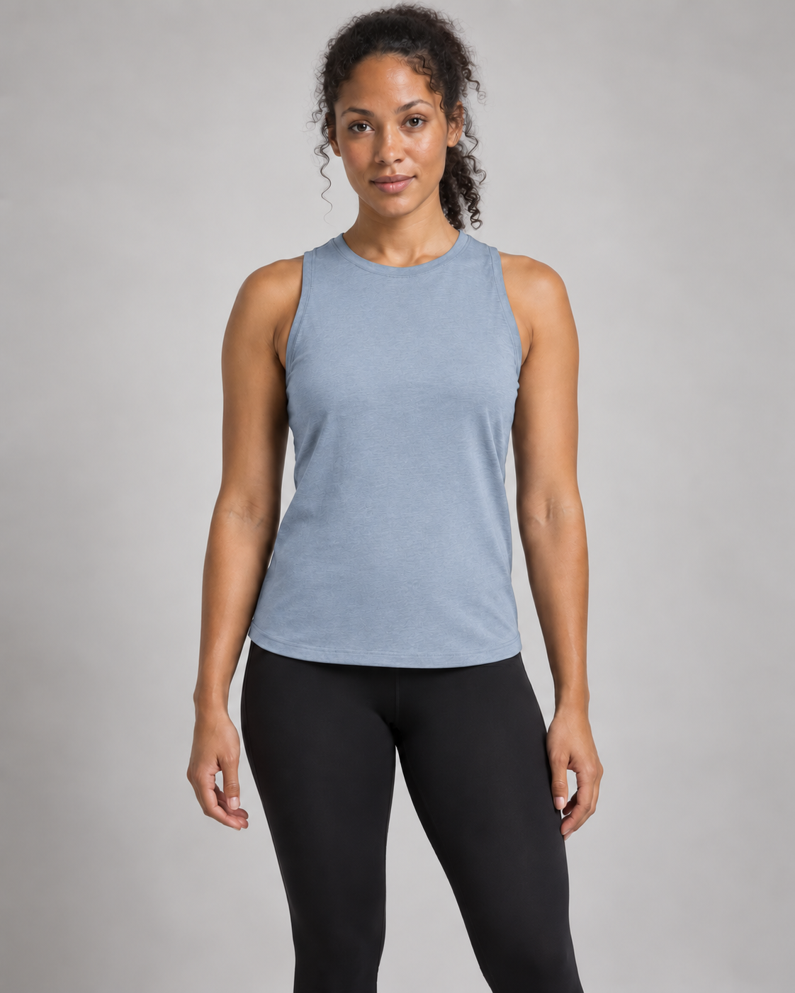 Akumi Motion High-Neck Tank in Mist Blue, front studio concept view.