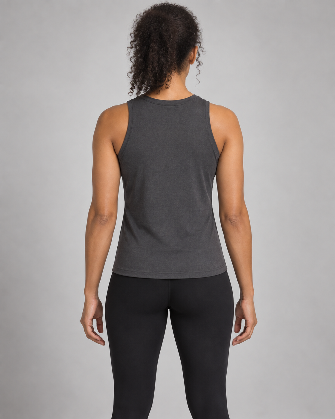 Akumi Motion High-Neck Tank in Graphite, back studio concept view on an adult woman.