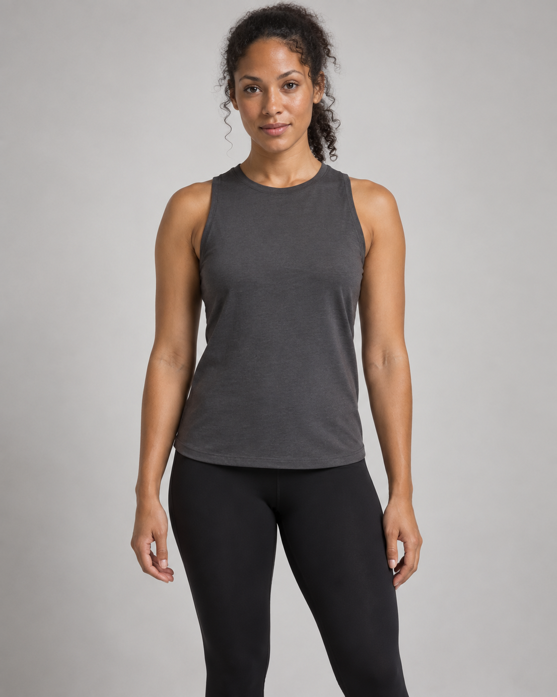 Akumi Motion High-Neck Tank in Graphite, front studio concept view on an adult woman.