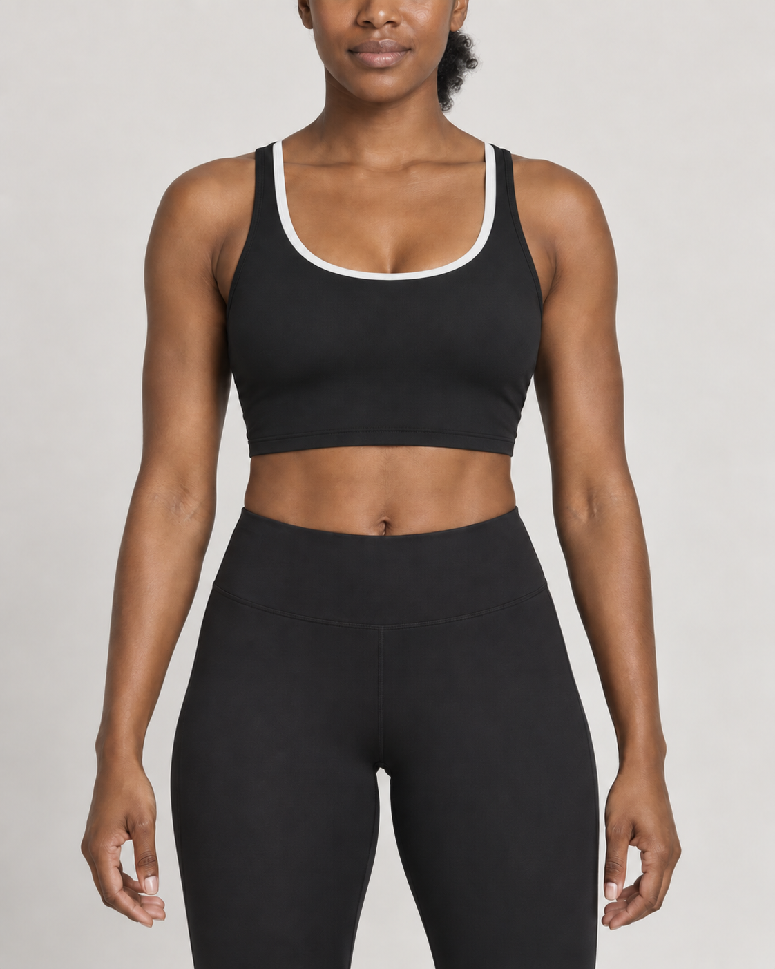 Design concept: Women's Offset Layered Sports Bra in Black / Chalk, front studio view