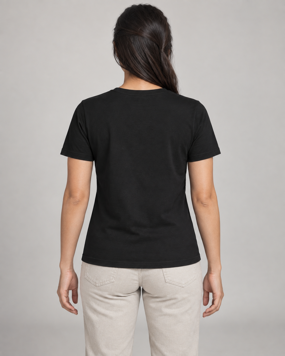 Generated concept mockup: women's Dayform Crew Tee in Black, back view on model.