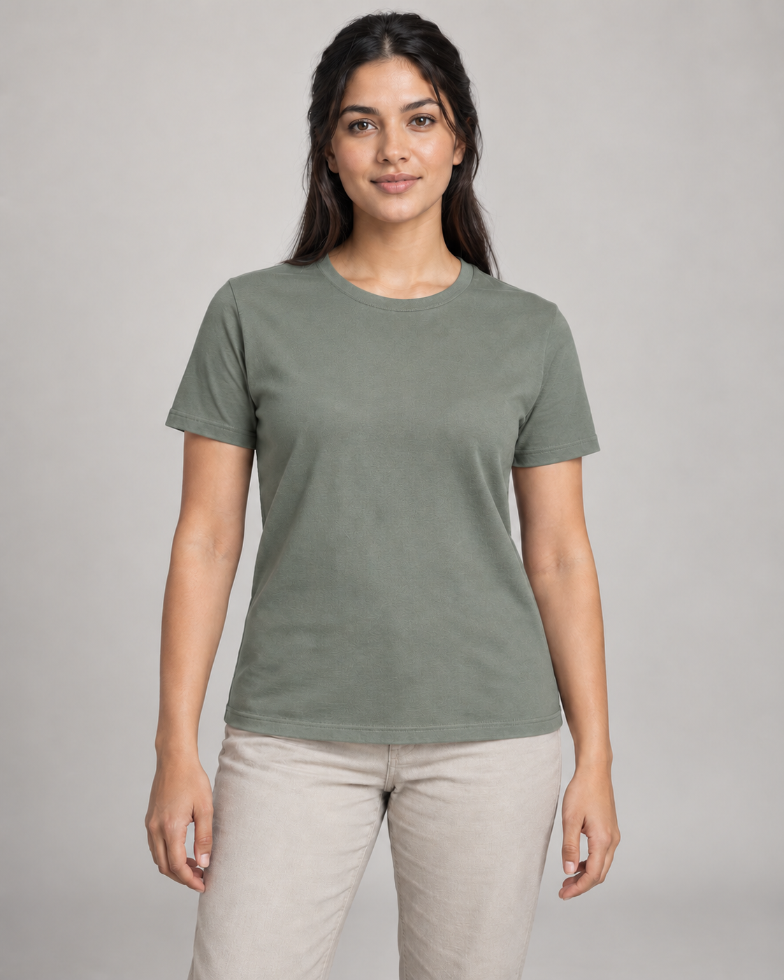 Generated concept mockup: Women's Dayform Crew Tee in Eucalyptus, front view on model.