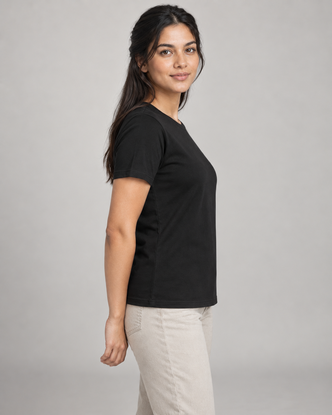 Generated concept mockup: women's Dayform Crew Tee in Black, side view on model.