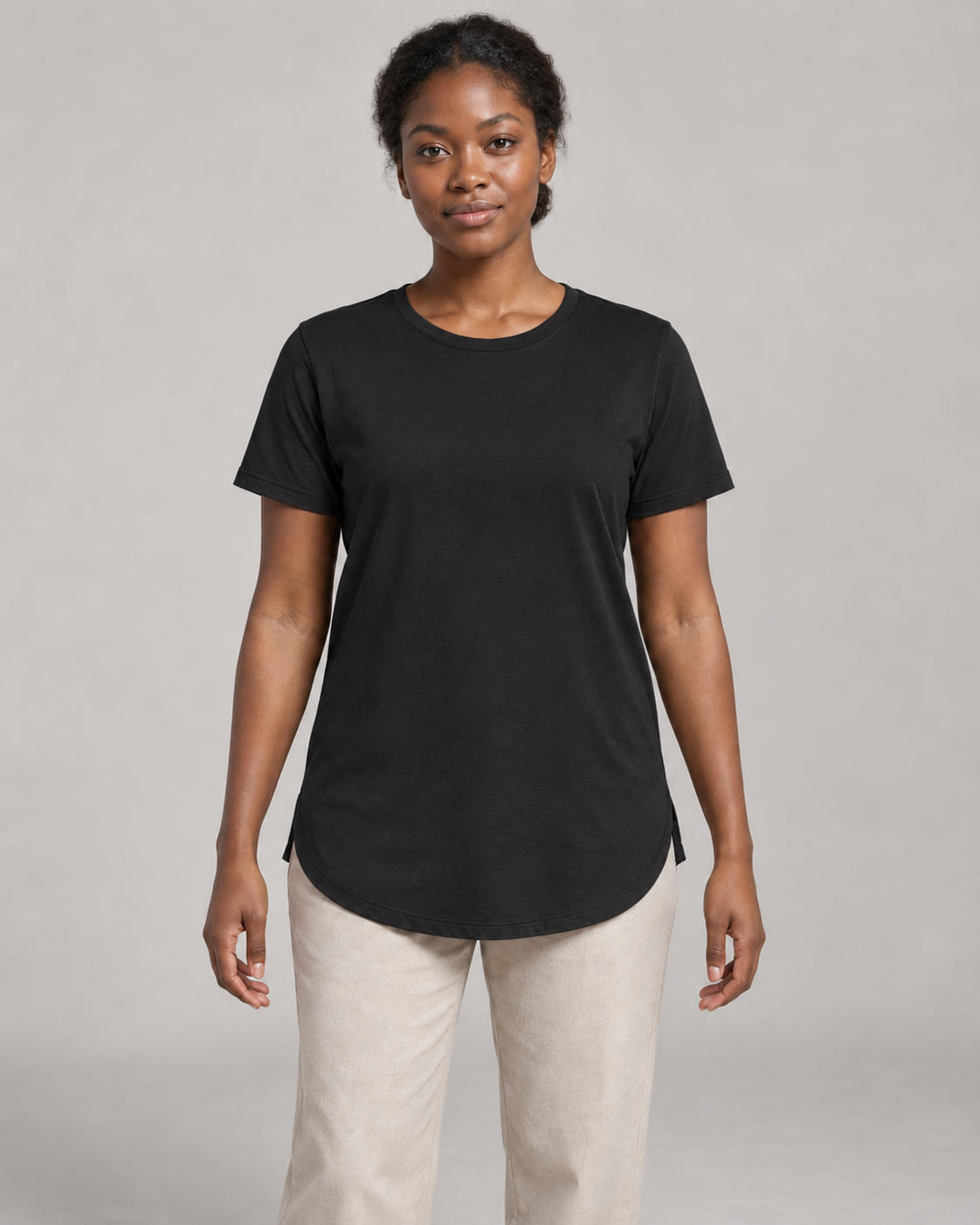 Generated concept mockup: Women's Dayform Longline Tee in Black, front view on model.