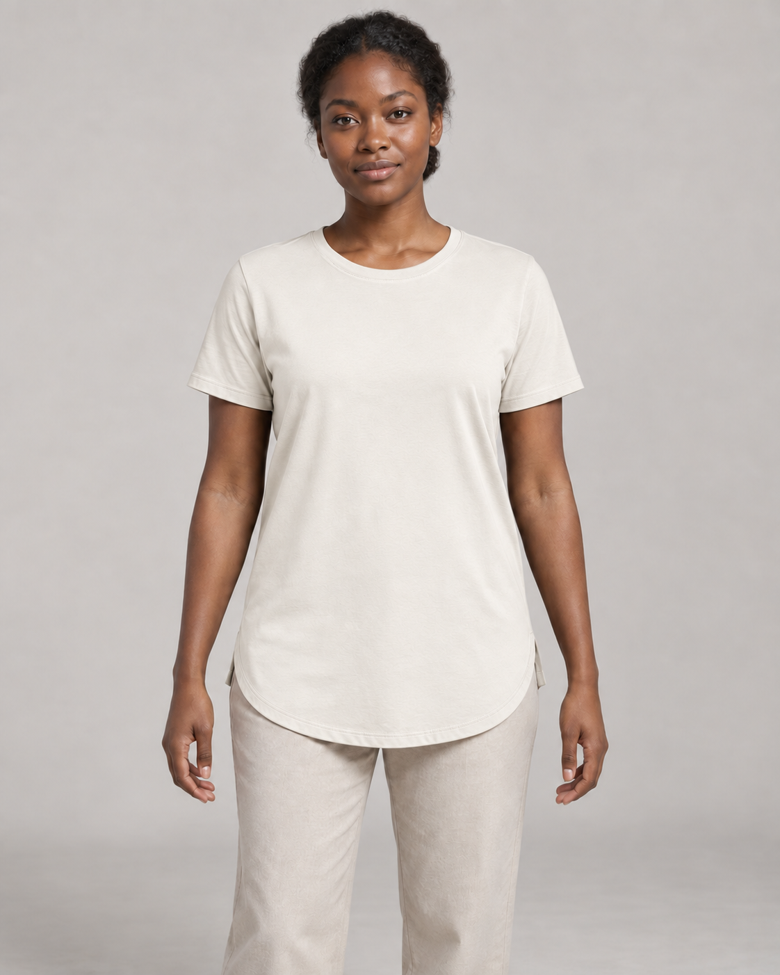 Generated concept mockup: Women's Dayform Longline Tee in Chalk, front view on model.