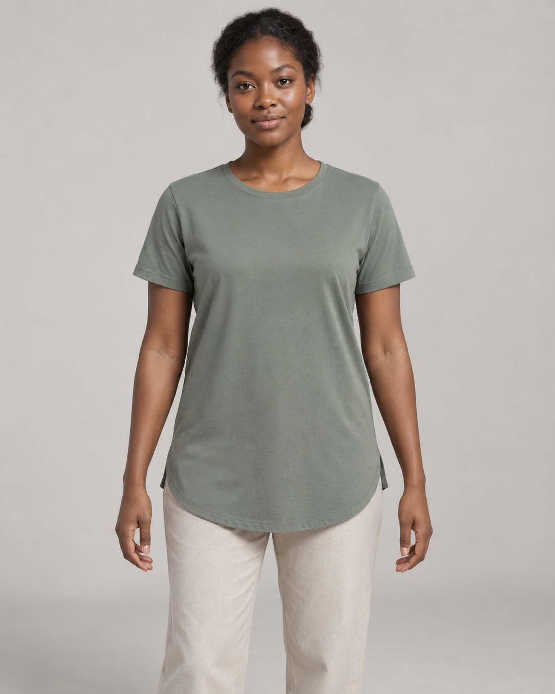Generated concept mockup: women's Dayform Longline Tee in Eucalyptus, front view on model.