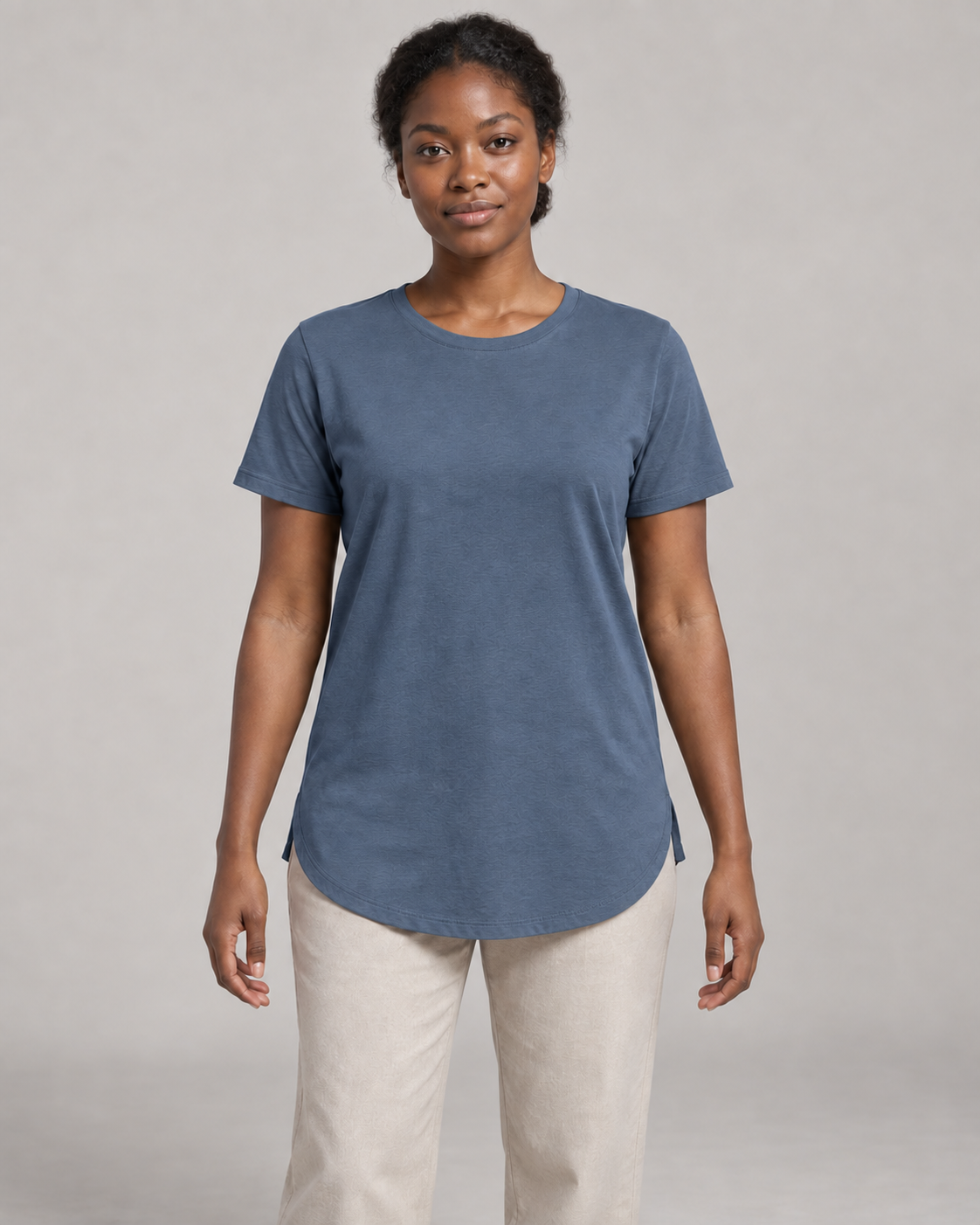 Generated concept mockup: Women's Dayform Longline Tee in Slate, front view on model.