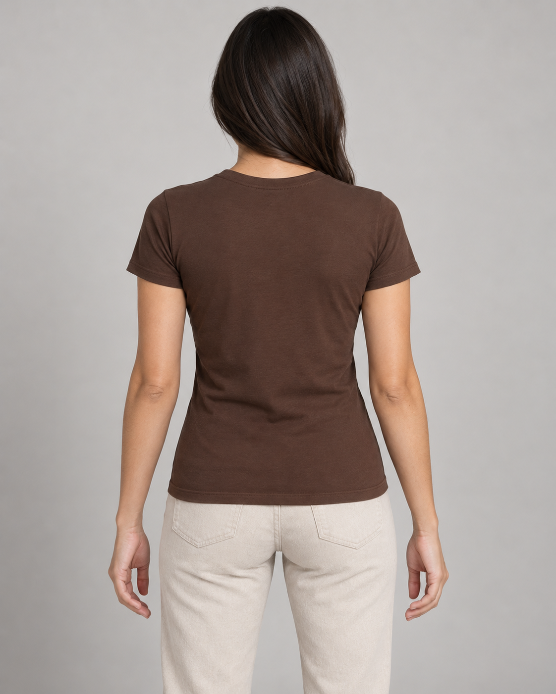 Generated concept mockup: women's Outline Fitted Tee in Cocoa, back view on model.