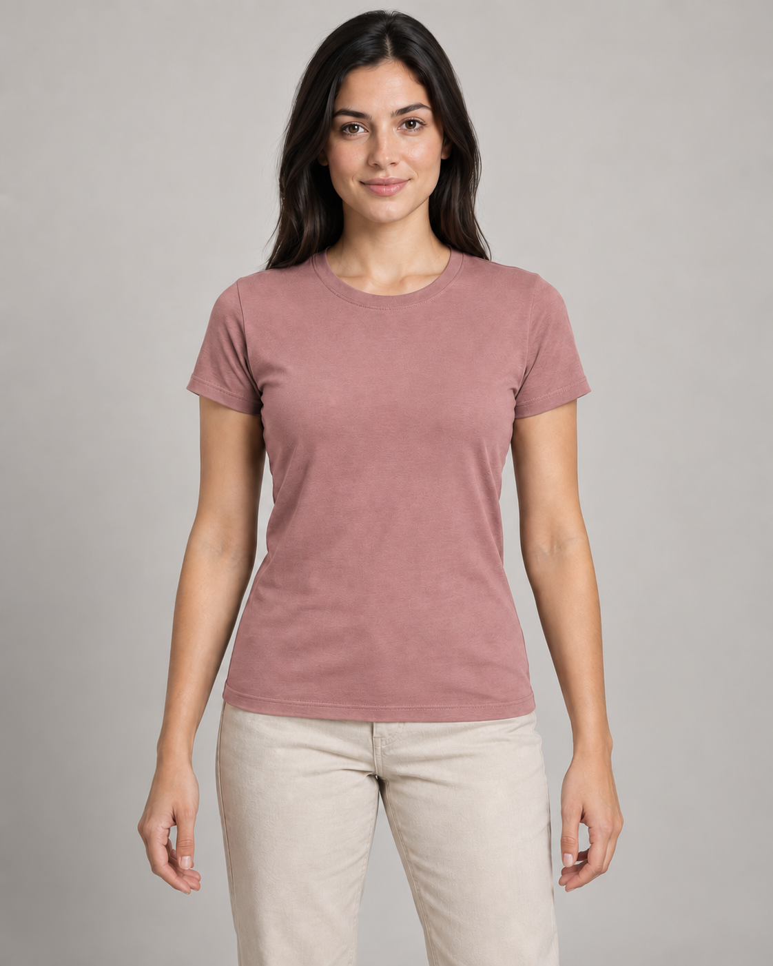 Generated concept mockup: Women's Outline Fitted Tee in Dusty Rose, front view on model.