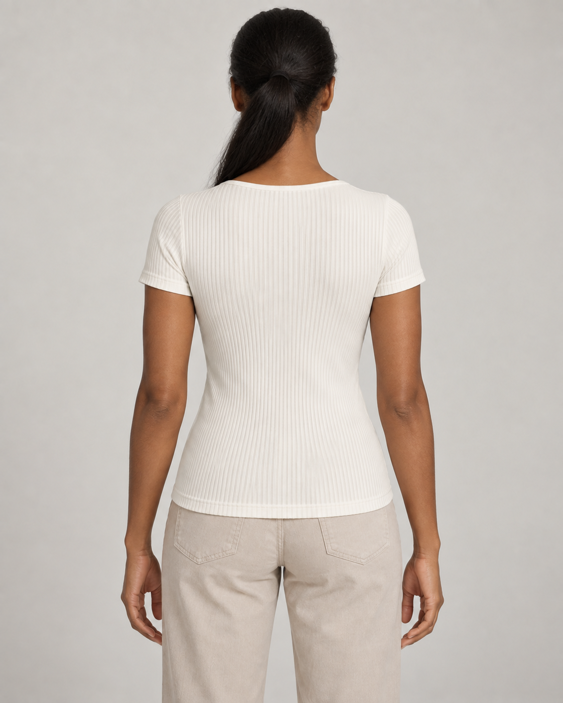 Generated concept mockup: women's Outline Rib Tee in Chalk, back view on model.
