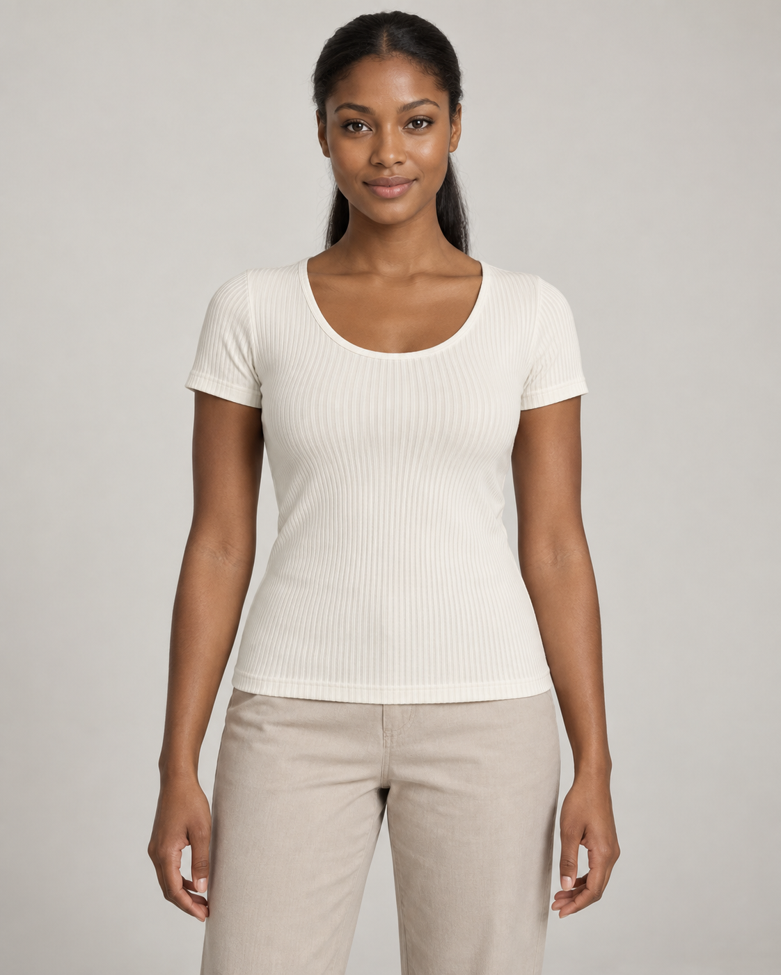 Generated concept mockup: women's Outline Rib Tee in Chalk, front view on model.