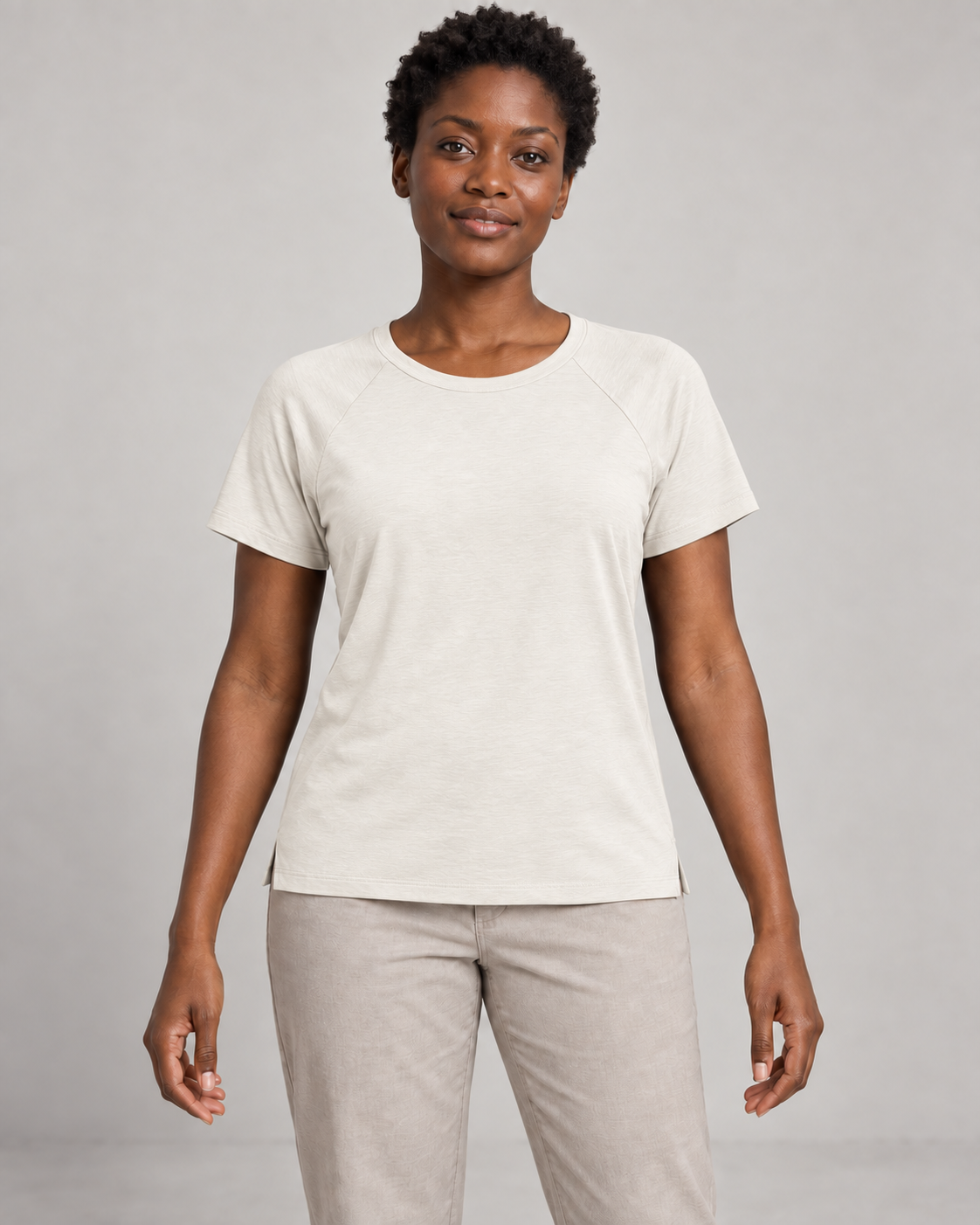 Generated concept mockup: Women's Cadence Raglan Tee in Chalk, front view on model.