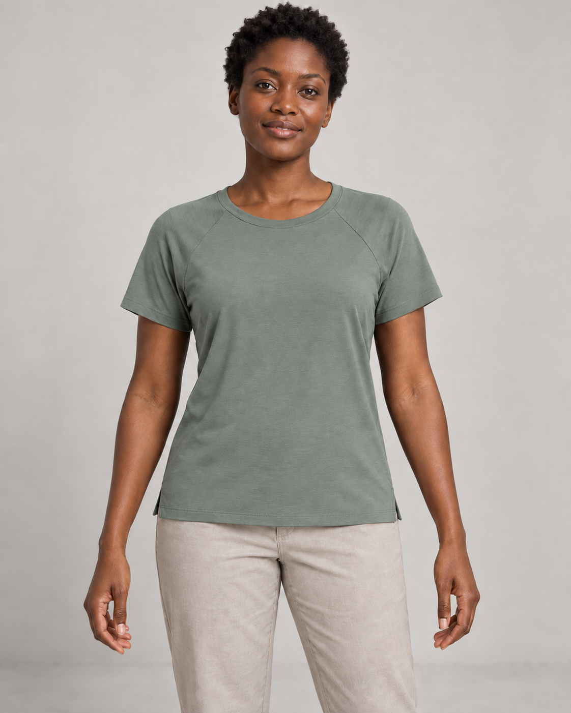 Generated concept mockup: Women's Cadence Raglan Tee in Eucalyptus, front view on model.