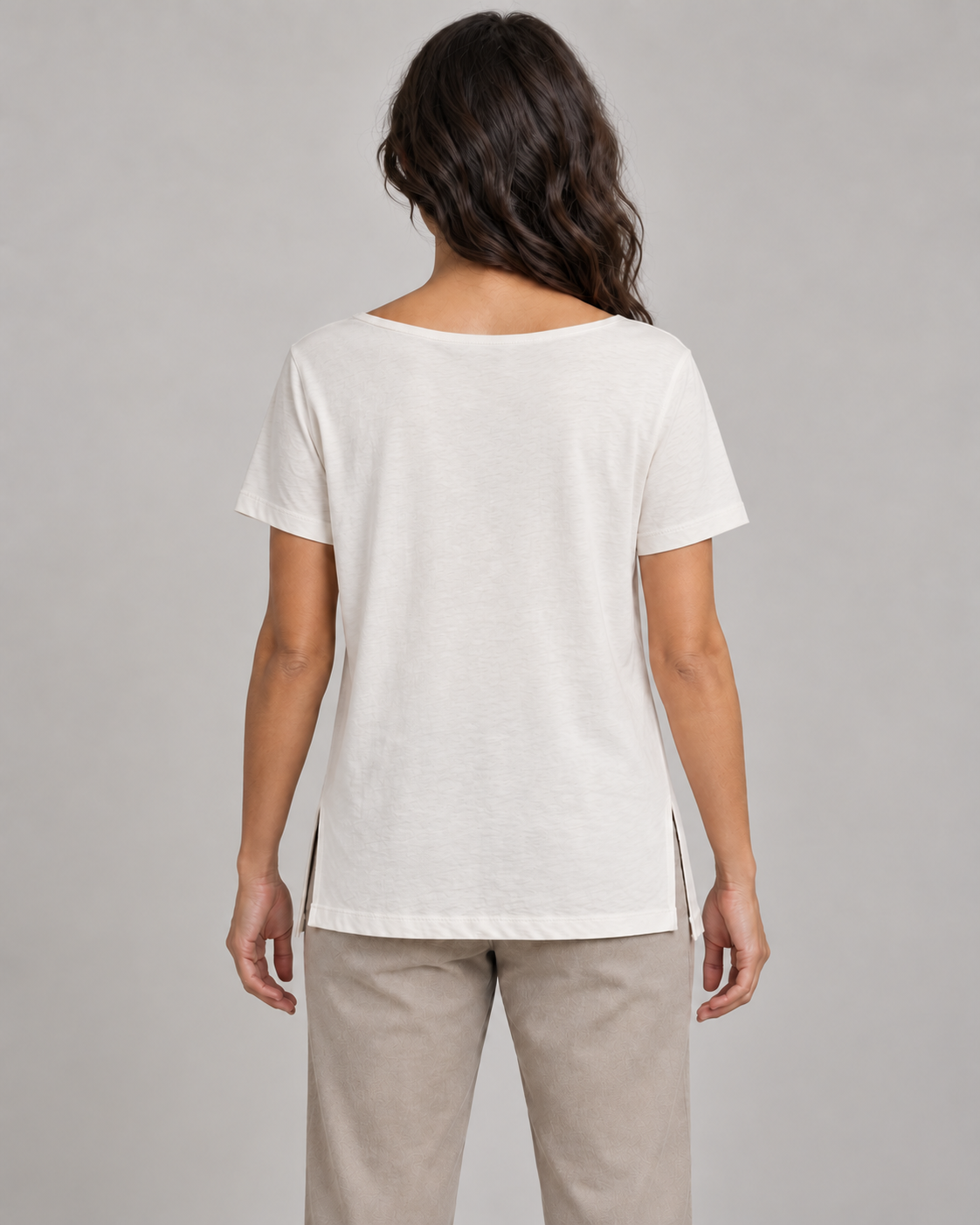 Generated concept mockup: women's Linea Split-Hem Tee in Chalk, back view on model.