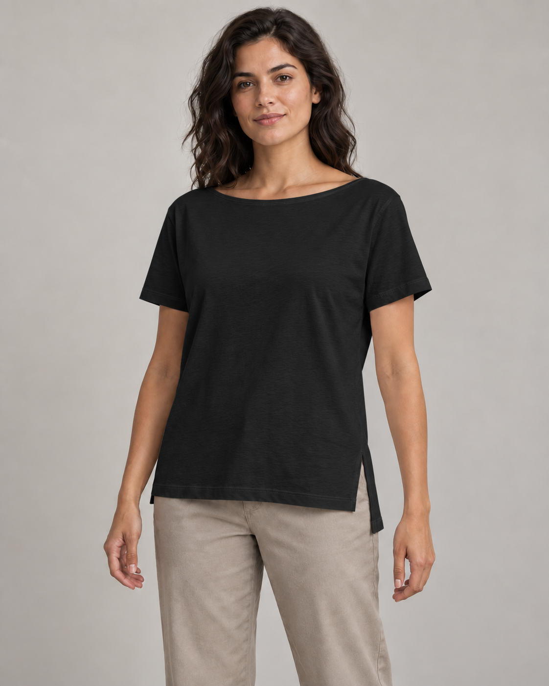 Generated concept mockup: Women's Linea Split-Hem Tee in Black, front view on model.