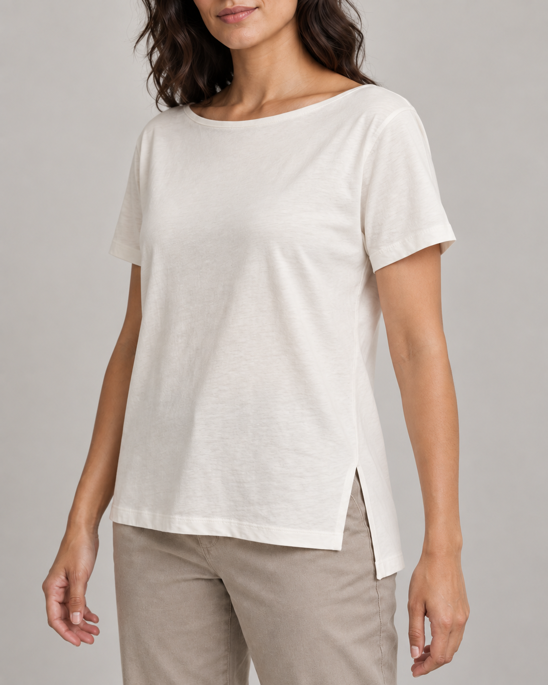 Generated concept mockup: Women's Linea Split-Hem Tee in Chalk, construction detail view highlighting wide neckline binding, set-in sleeve seam, side slit and high-low split hem.
