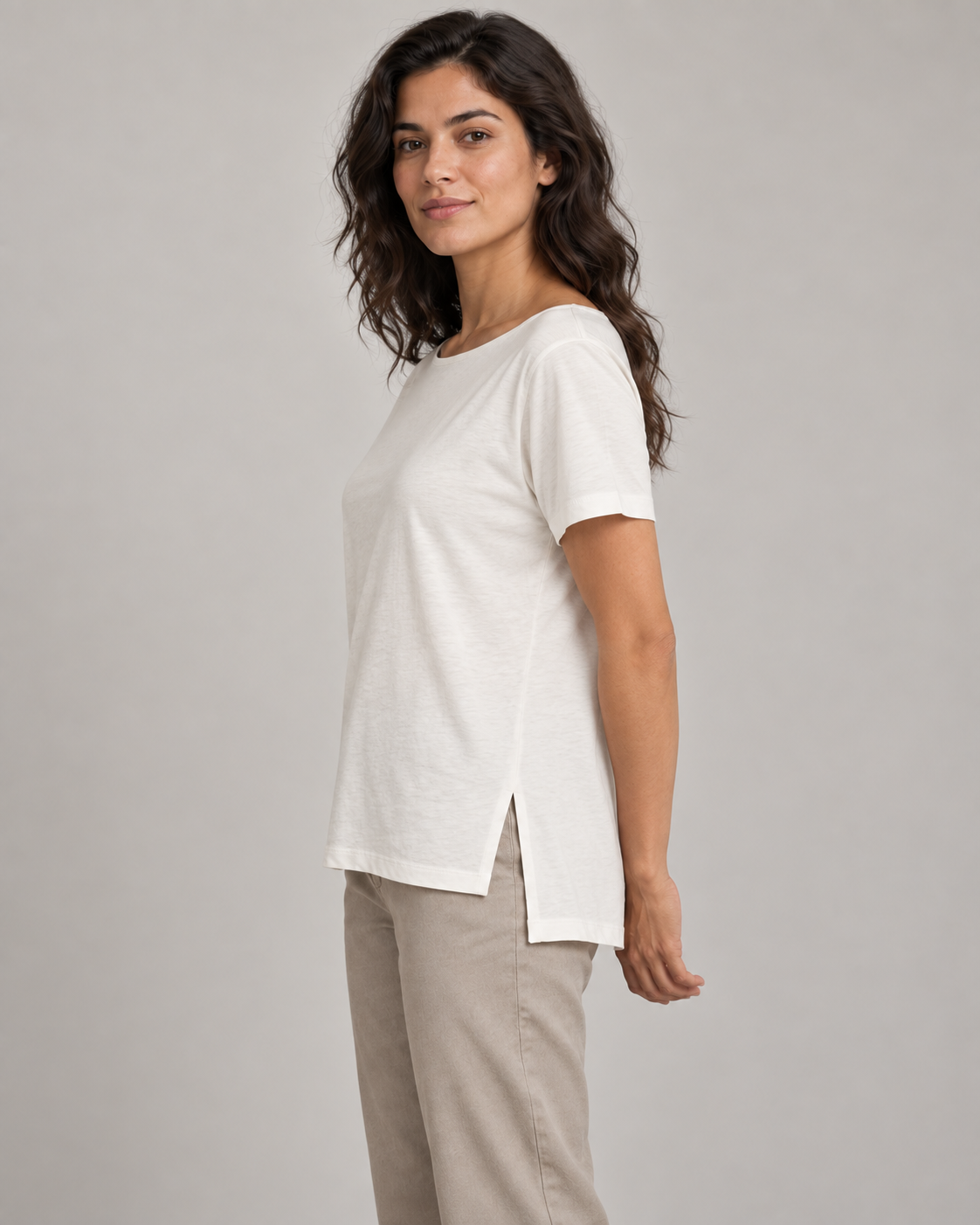Generated concept mockup: women's Linea Split-Hem Tee in Chalk, side view on model.