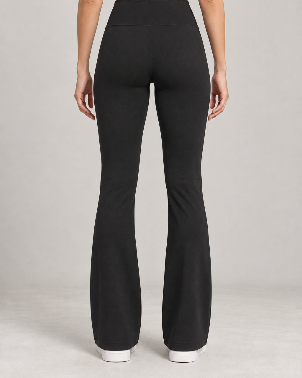 Generated concept: Akumi Arc Slim Flare Legging 31 inch in Black, back studio view