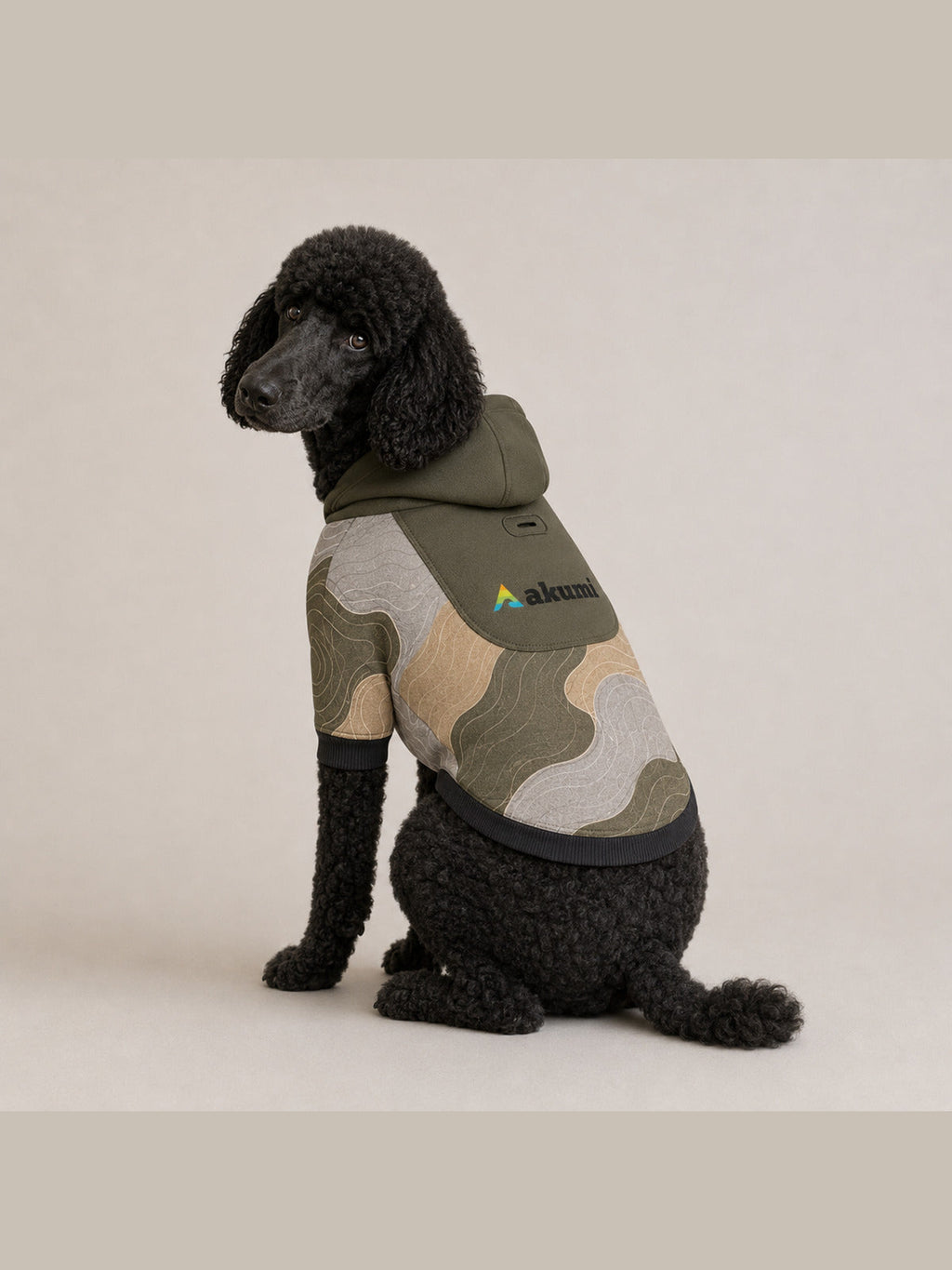 Black standard poodle wearing the Akumi Contour Pet Hoodie in Canyon Fog, rear three-quarter view
