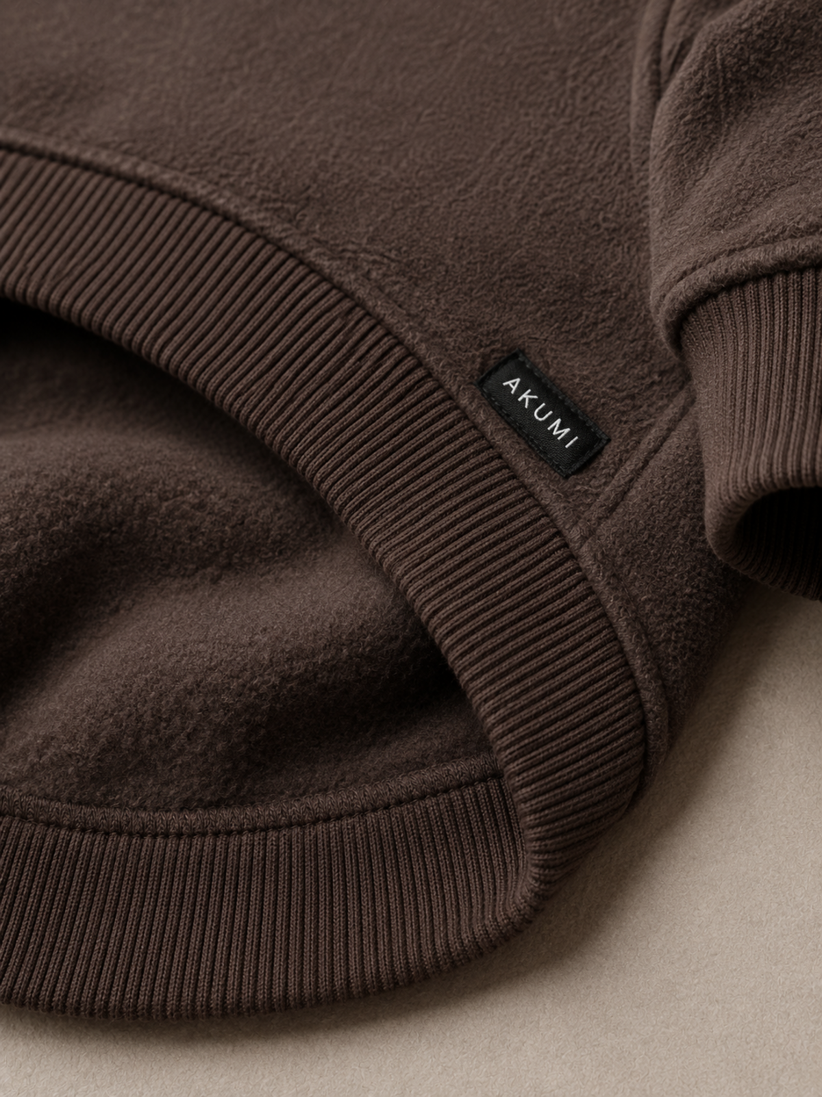 Grounded Fleece Pet Hoodie fleece and Akumi label detail