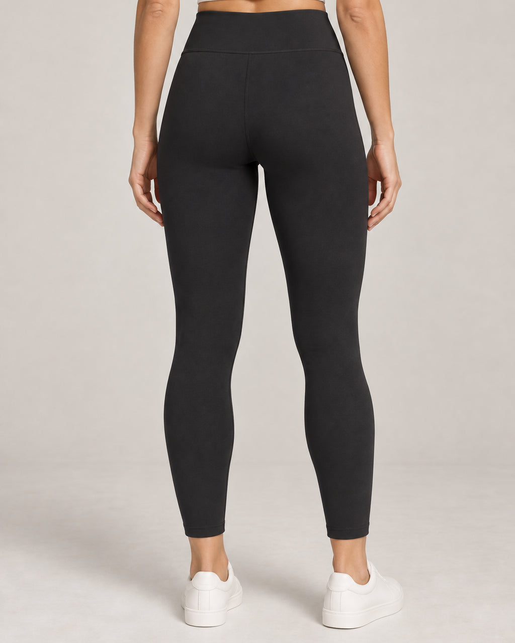 Generated concept: Akumi Still High-Rise Legging 25 inch in Black, back studio view